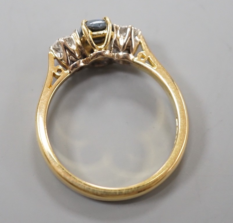 A modern 18ct gold, black opal and diamond set three stone ring, size Q, gross weight 4.6 grams